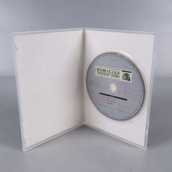 Öppen DVD-fodral med Homicide Uppdrag Mord disc inuti