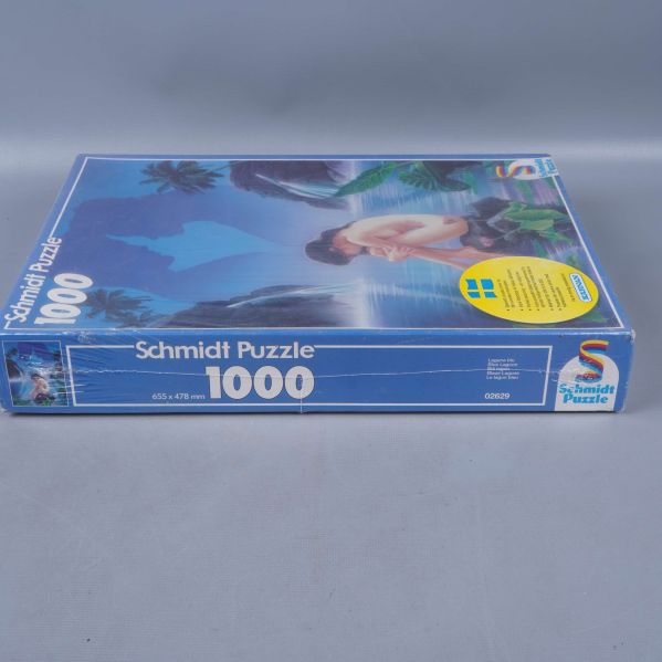 Pussel liggande, motiv och Schmidt Puzzle-text på sidan