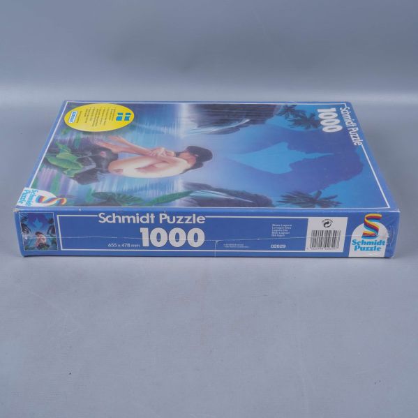 Pussel liggande, sidan med Schmidt Puzzle-logga och bitantal