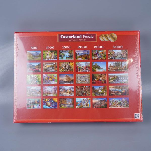 Baksida av pussellåda visar olika motiv och storlekar från Castorland