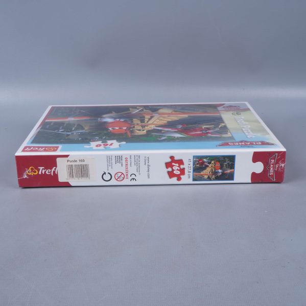 Pusslets långsida med bitantal och ålderssymbol