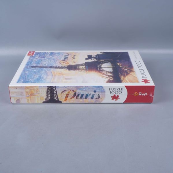 Sidoetikett på Paris pussellåda med motivdetaljer