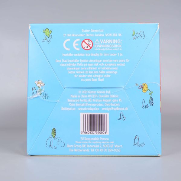 Undersidan av Beat That visar varningsmärkning och tillverkardetaljer