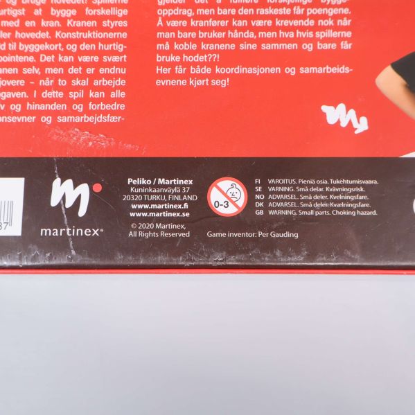 Närbild av baksidan på Bild'it 2.0 med tillverkare och varningstext