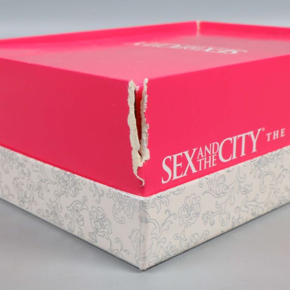 Skada på kanten av Sex and the City boxen