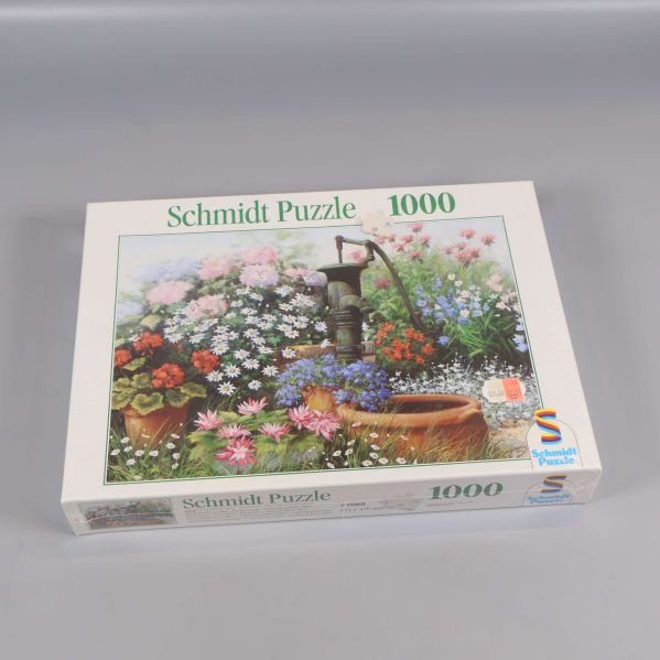 Schmidt Puzzle 1000 bitar med blomsterdesign på locket