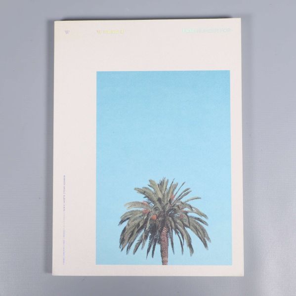 Framsidan av album med palmträd på blå bakgrund
