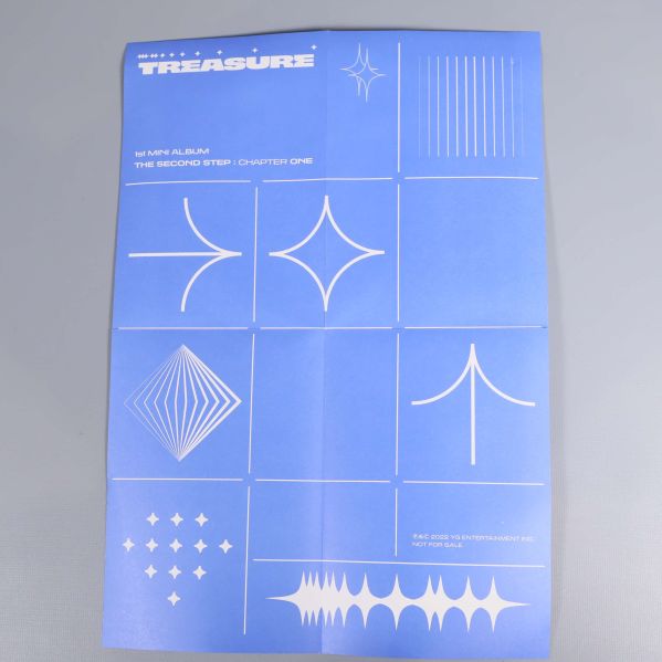 Blå affisch med olika vita grafiska symboler från Treasure