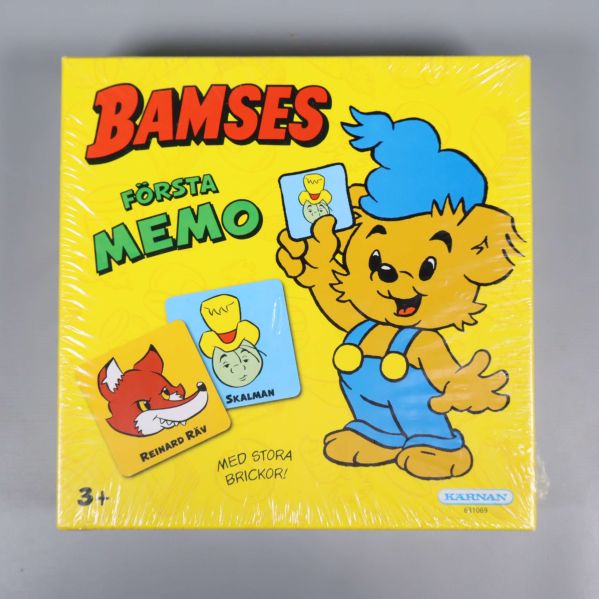 Framsida på Bamses Första Memo med Bamse och spelbrickor