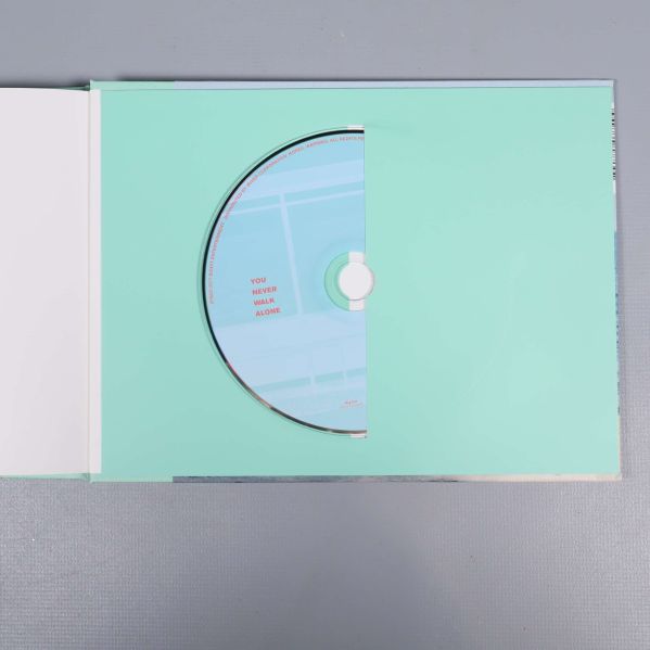 Album med CD-skiva i mintgrönt fack