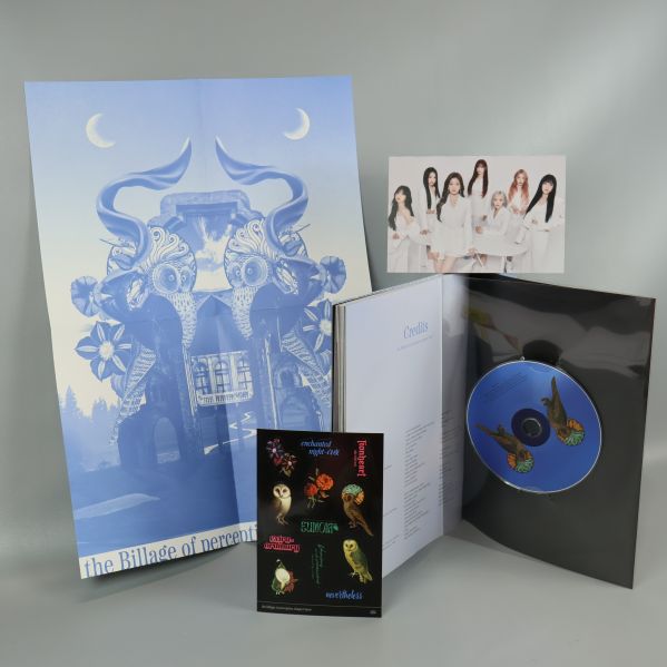 CD-skiva, fotobok, affisch och fotokort uppställda