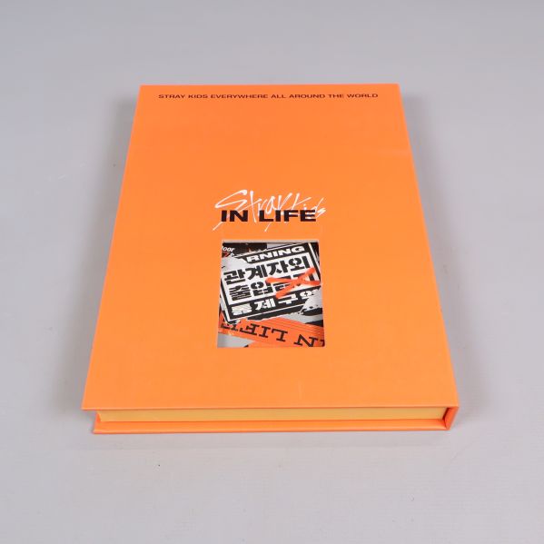 Framsida av orange album med texten In Life