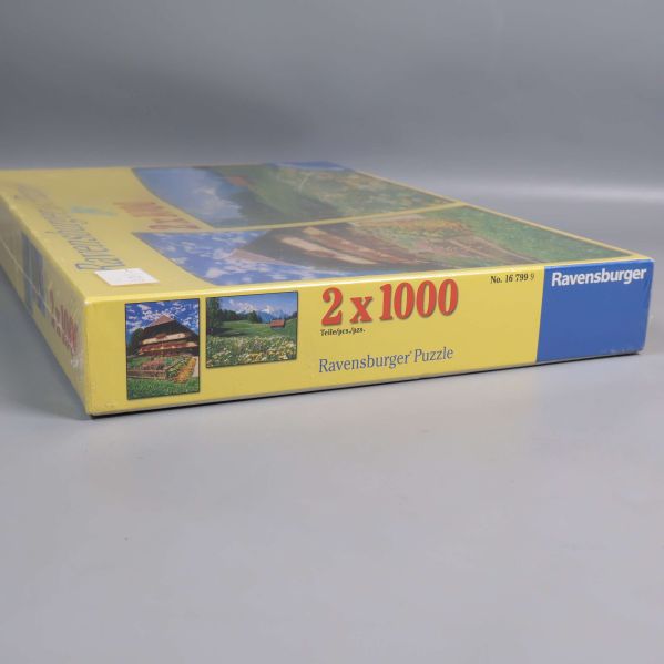 Närbild av sidan på Ravensburger pusselbox, 2 x 1000 bitar