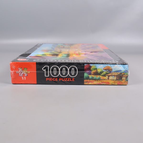 Kort gavel av pussellåda med 1000 piece puzzle och motiv