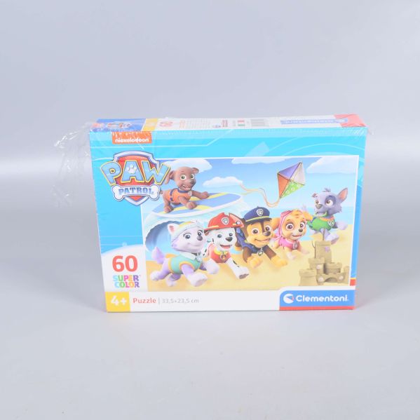 Framsidan av Paw Patrol pussel med valpar och drake