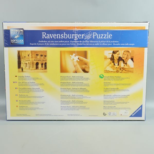 Baksida av Ravensburger pussel med information på flera språk