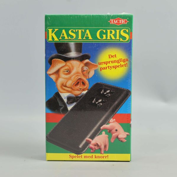 Förpackning till Kasta Gris med illustration av gris och spelask