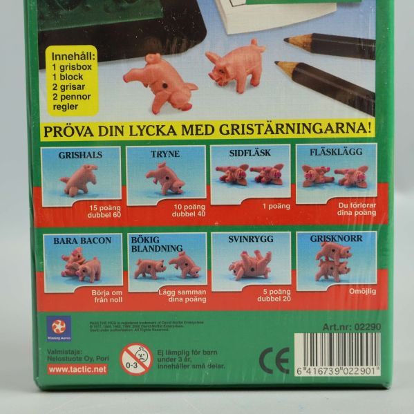 Närbild på baksidan av Kasta Gris visar poängräkning och regler