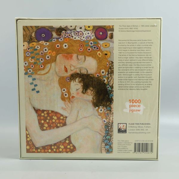 Baksida av pussellåda med information och motiv av Gustav Klimt