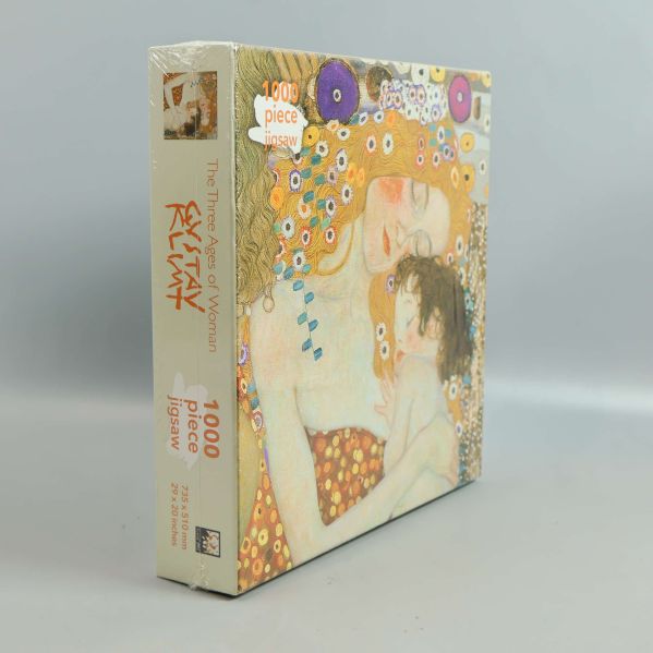 Pussellåda i vinkel med Gustav Klimt-motiv och 1000 piece-märke