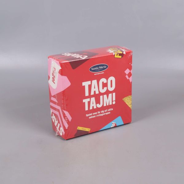 Taco Tajm-spel sedd ur vinkel med fokus på framsidan och sidan