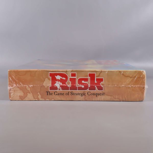 Risk kortsida med logotyp och spelslogan