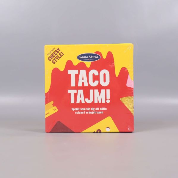 Framsidan av Taco Tajm sällskapsspel med färgglad design