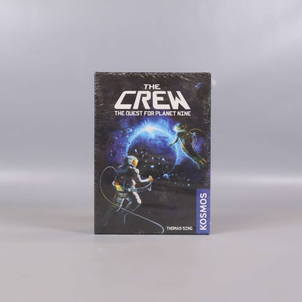 Framsidan av spelasken The Crew med astronautmotiv