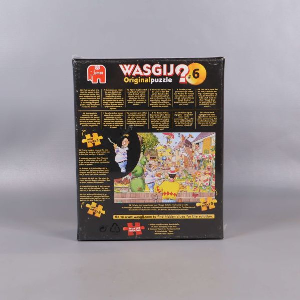Baksidan av Wasgij originalpussel med motiv och text