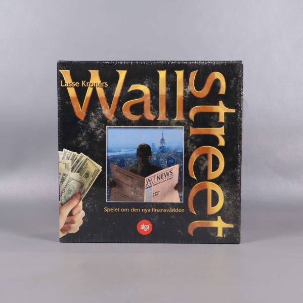 Framsidan på Wallstreet sällskapsspel med stor guldfärgad logotyp