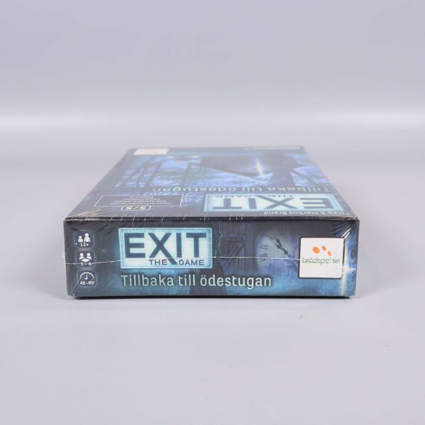 Nedre kant av spelboxen för Exit the Game Tillbaka till ödestugan