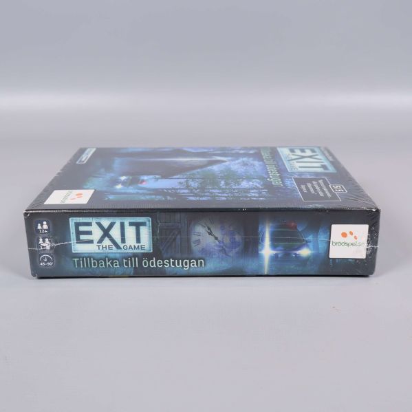 Sidovy på Exit the Game Tillbaka till ödestugan spelboxen