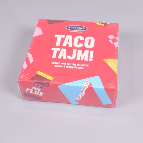 Taco Tajm-spel fotograferat ovanifrån på ljus bakgrund