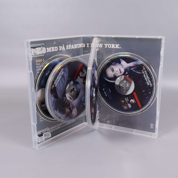 Öppen DVD-box med fyra skivor synliga