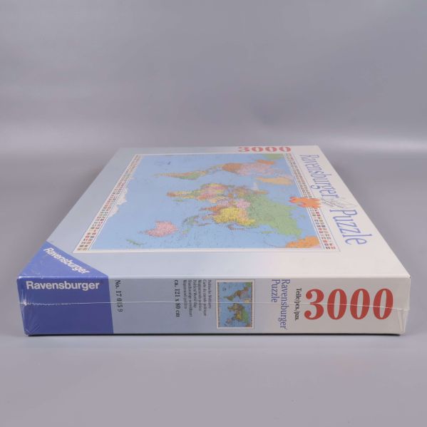 Ravensburger pussellåda, sidan med text och motiv