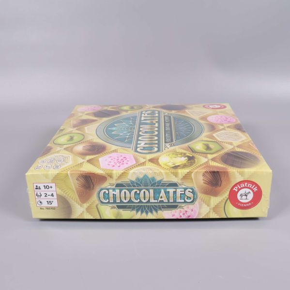 Sidan av Chocolates spelask med praliner