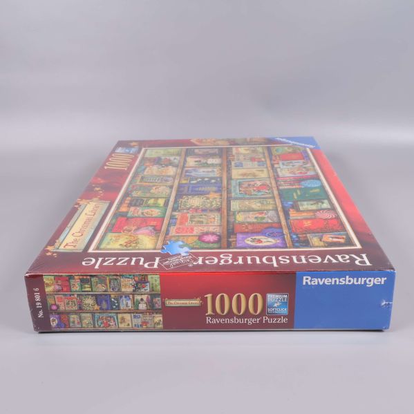 Ravensburger pussellåda med julmotiv och sidotext