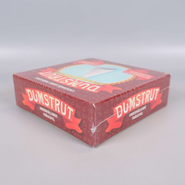 Dumstrut spel ask från sidan, visar boxens tjocklek