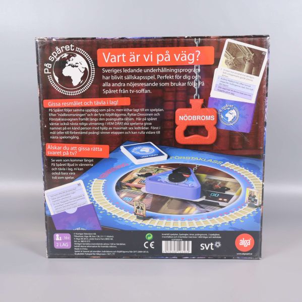Baksidan av På spåret spelet med speltavla och instruktionstext