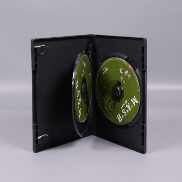 DVD-box öppen med två gröna skivor synliga