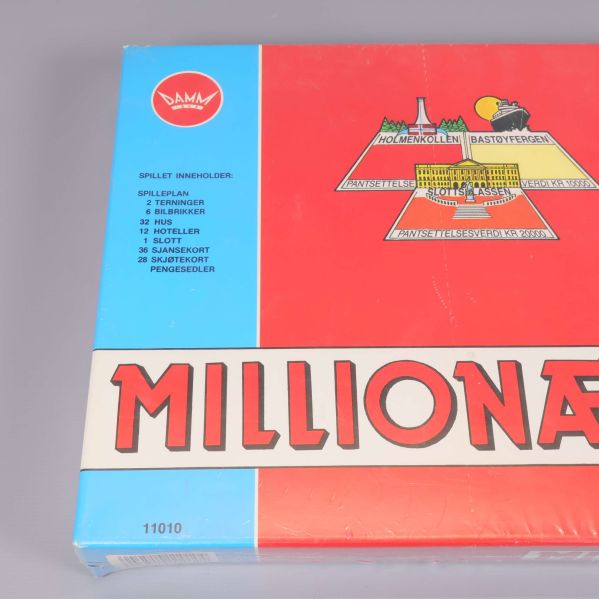 Närbild på Millionær ask med innehållslista