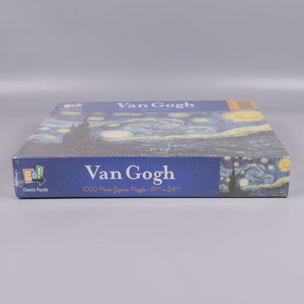 Sida av pussellåda med Van Gogh motiv och logga