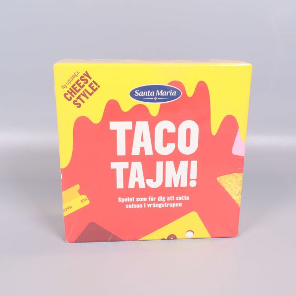 Framsidan av Taco Tajm spelask med taco-motiv