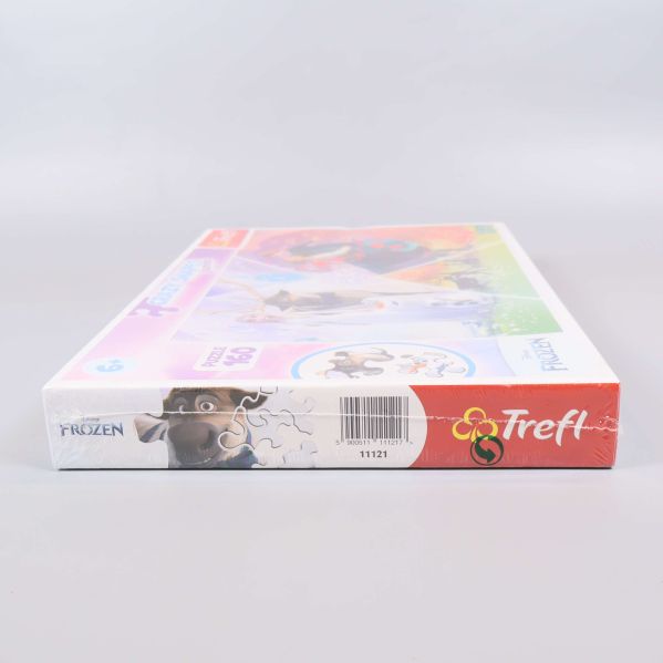 Undersidan av pussellåda med Trefl logotyp och motivdetalj