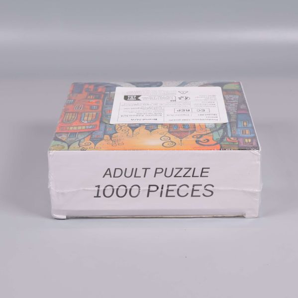 Pussellåda med texten Adult Puzzle 1000 Pieces