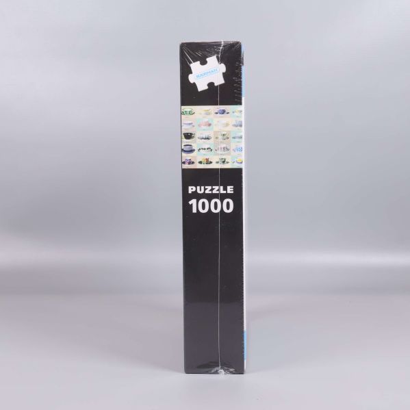 Smal sida av pusselask med texten Puzzle 1000
