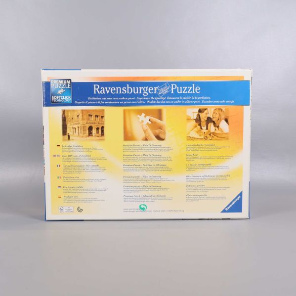 Baksida på Ravensburger pusselask med produktinformation och bilder