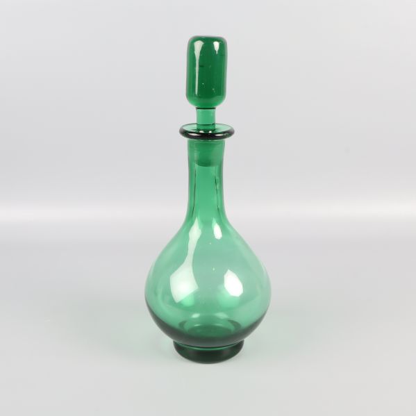 Grön glasflaska med knopp