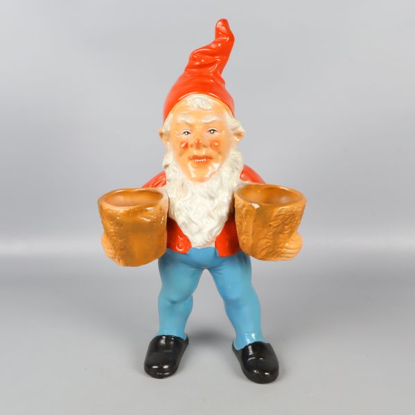 Tomtefigur med två krukor i händerna