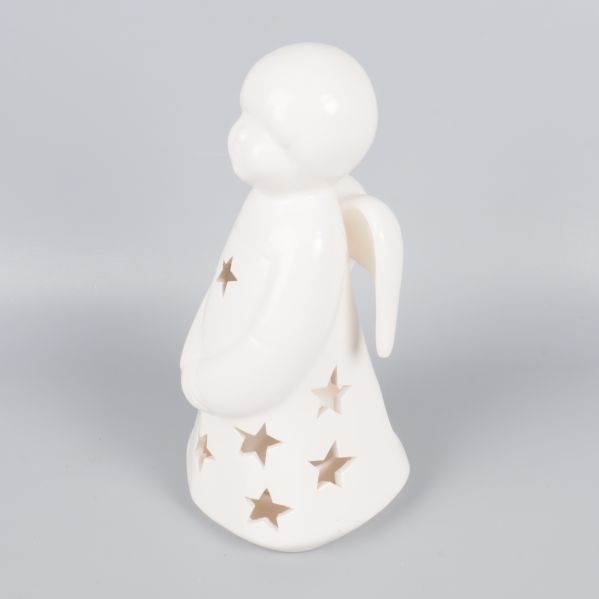 Närbild på ängellykta från sidan, visar vinge och stjärnor